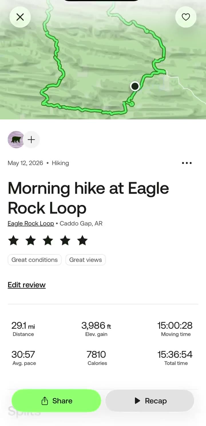 Overhead trail map with a GPS track winding through the Ouachita ridgeline and a real-time pace, split, and elapsed-time overlay