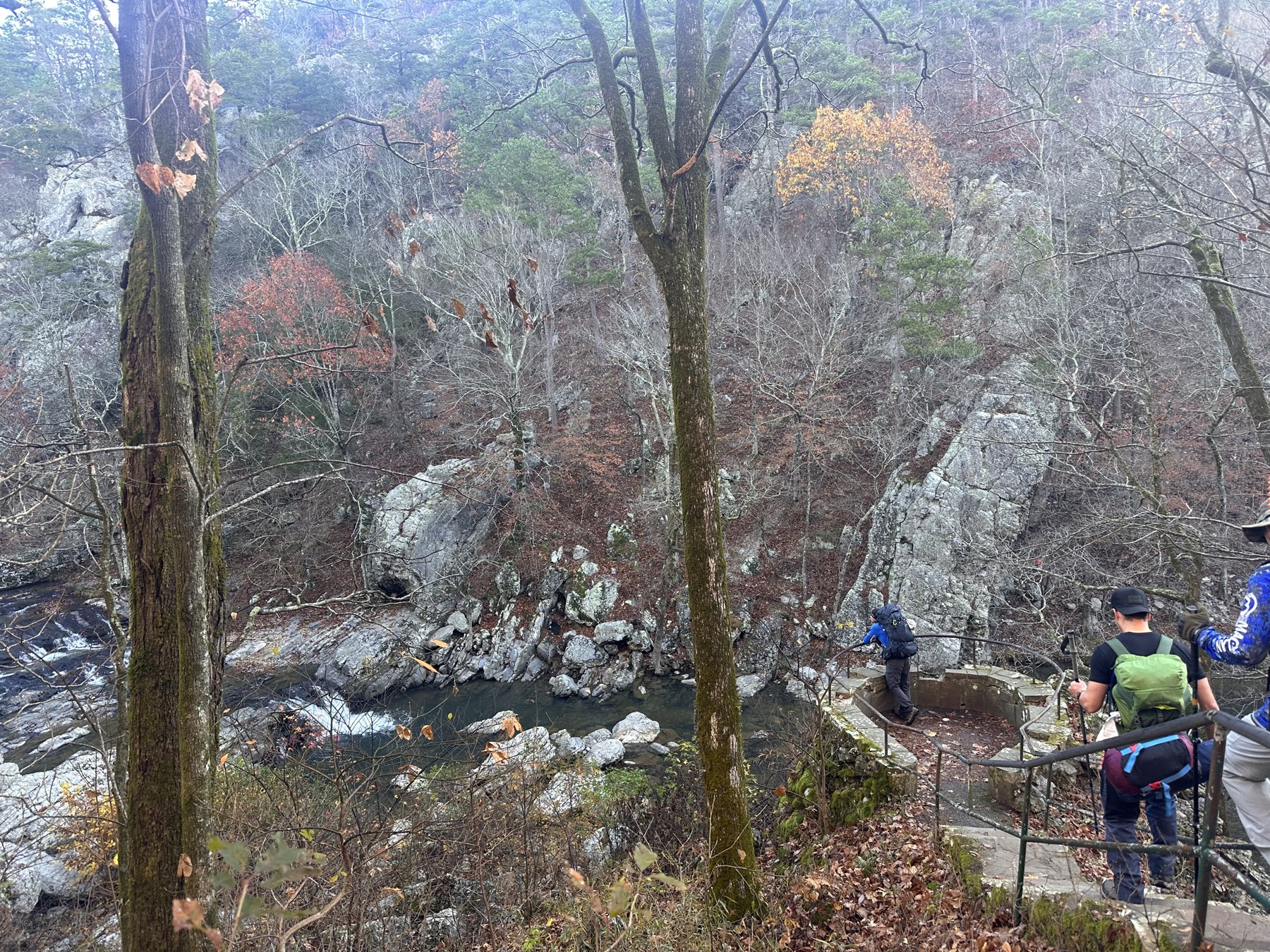 Rocky creek from above with fall foliage on the banks
